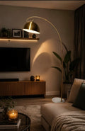 Arch Floor Lamp with gold dome shade and marble base in a modern living room