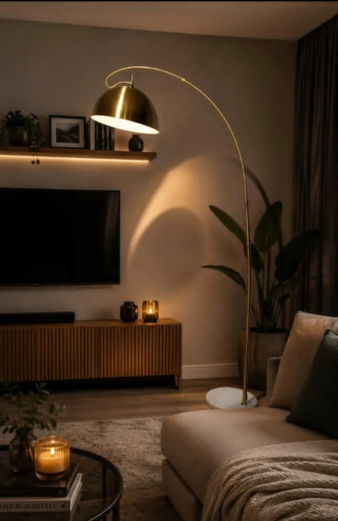 Arch Floor Lamp with gold dome shade and marble base in a modern living room