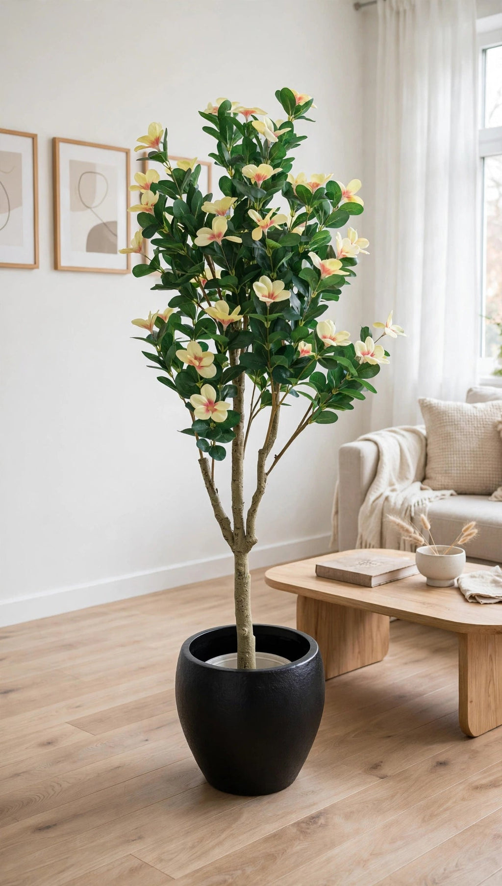 55 inch artificial magnolia flower tree with black pot beside sofa in contemporary interior
