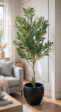 65 inch artificial olive tree with black pot placed at luxury home entrance flanking wooden door