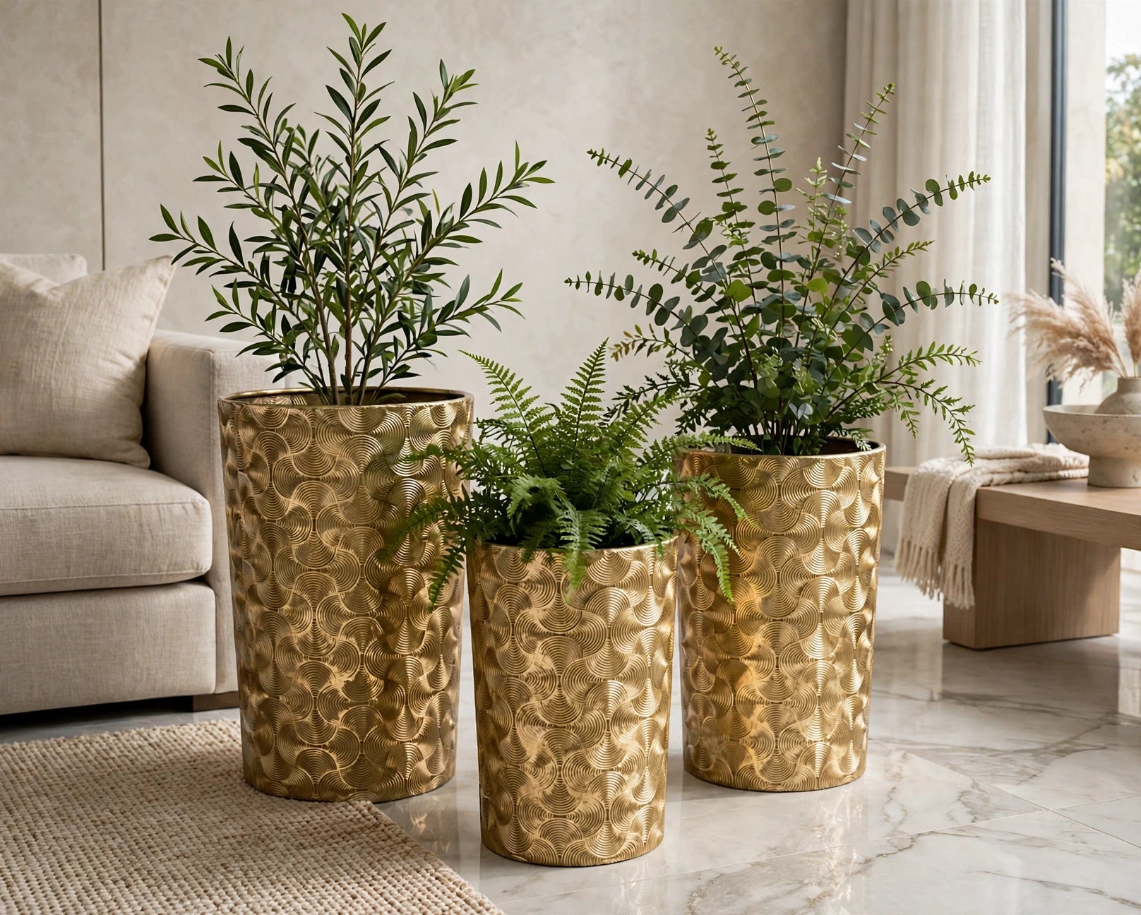 Gold embossed cylindrical planter set of 3 with artificial plants in a modern living room