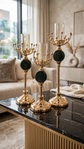 Luxury Candle Stand Set of 3 in gold and emerald green on marble table