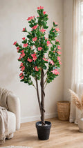 70 inch artificial Bougainvillea tree with pink blossoms in a black pot – styled in a bright living room