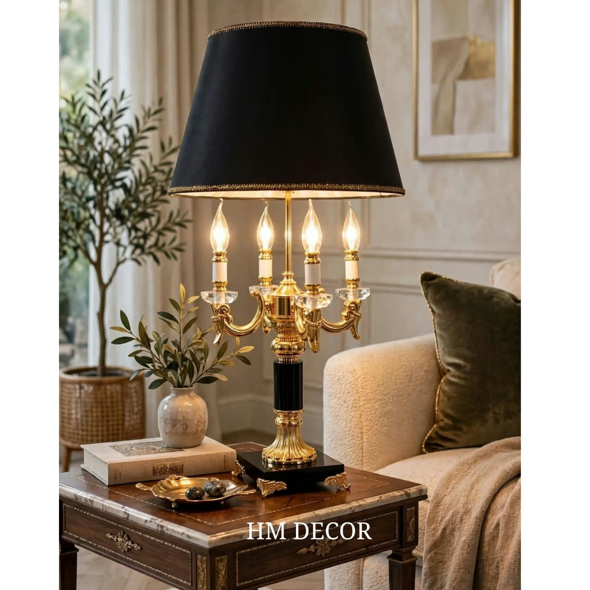 Classic black tapered shade table lamp with ornate gold-tone base and candle-style arms