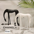 Abstract grazing horse figurine 9.5 inch in matte black and white on marble surface