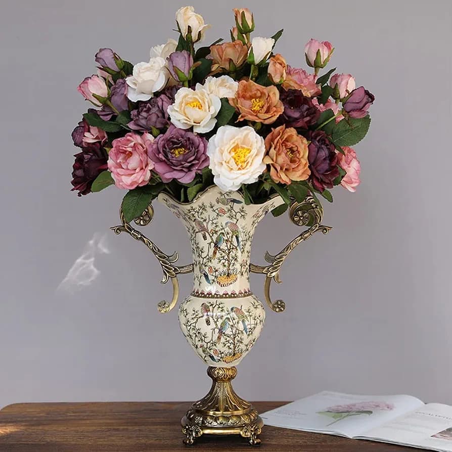 European porcelain vase with brass handles styled with mixed floral arrangement