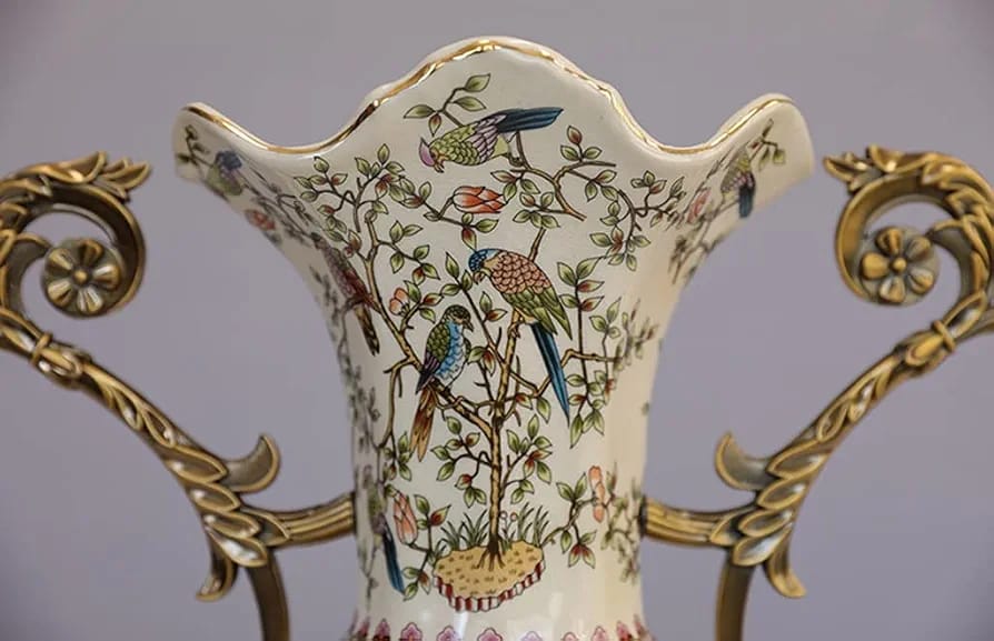 Scalloped neck detail with hand-painted birds on porcelain vase