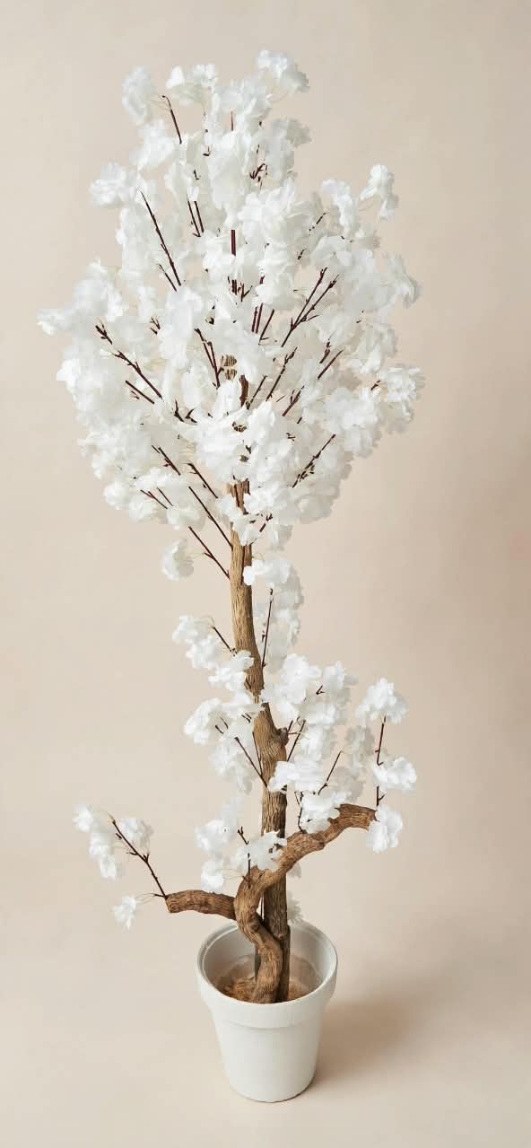 Artificial white cherry blossom tree product shot in white pot